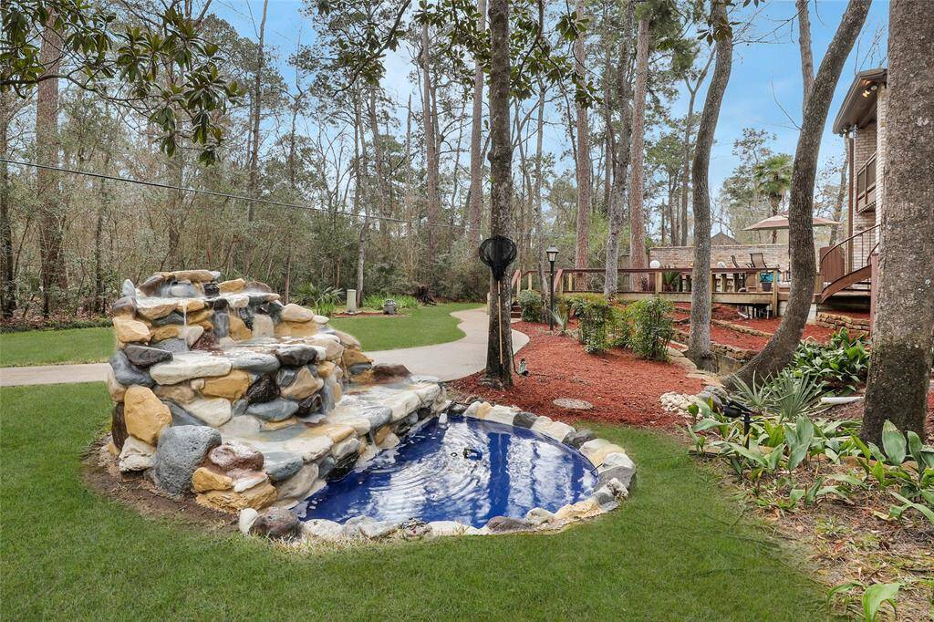 Water is calming - relax and unwind on the courtyard area and relax! Concrete path way in rear of property gets you any place you need to be without getting dirt on your feet!