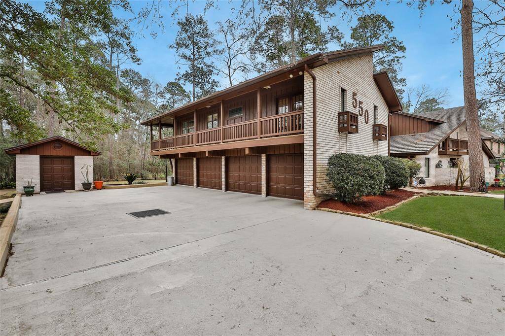 Bring all your toys - there is plenty of space! This 4 car garage has wall to wall pegboards, three closets for storage and thermostat controlled outlet. Bay three is arranged with installed sturdy metal storage shelves.