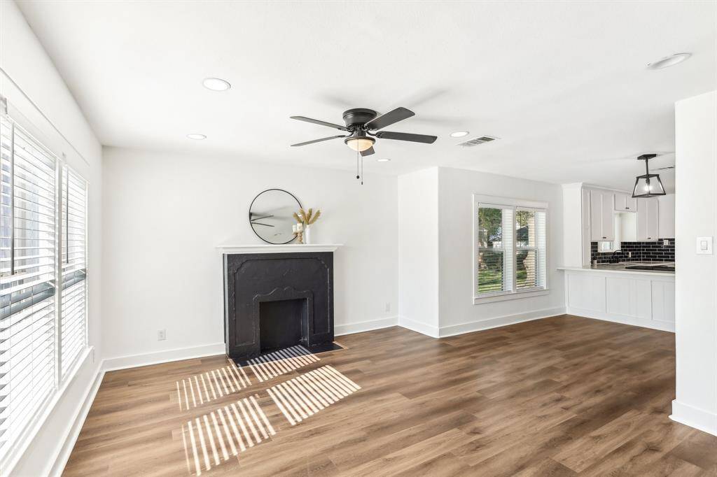 View of the living area and dining area from the front door.