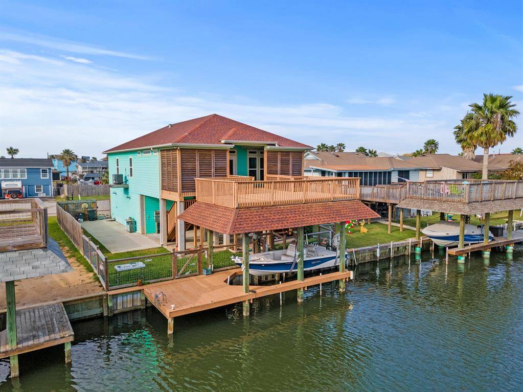Privacy Louvers, full fenced yard, boat house, lift and party deck.