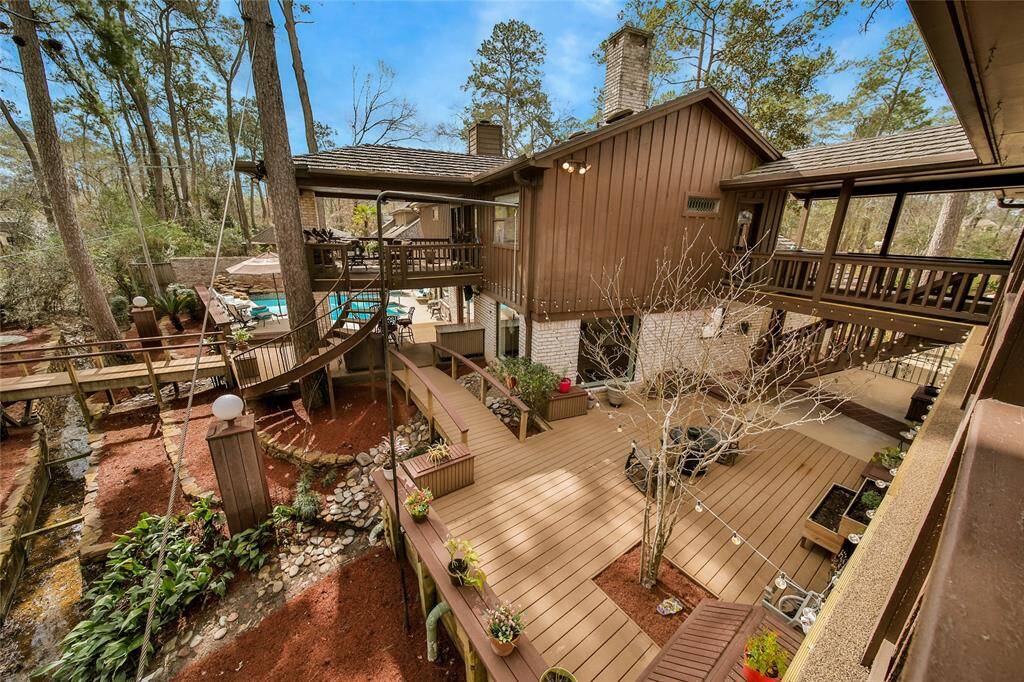 The "treehouse" view is spectacular! This view is from the guest house! LOVE the ample deck area - great separation for different activities! Fresh landscaping just completed!