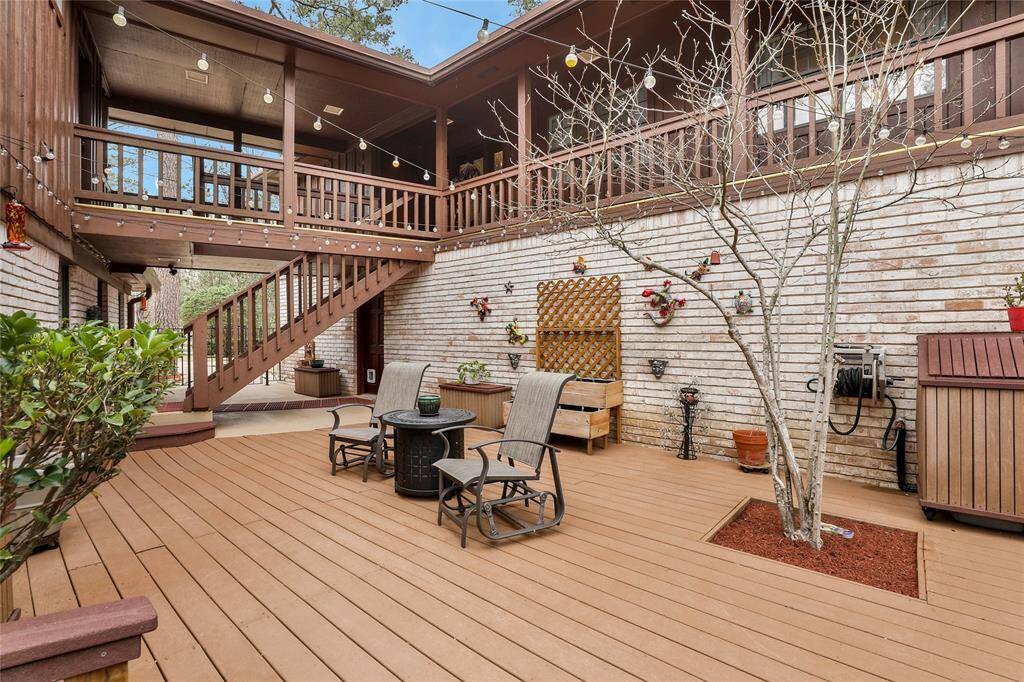 Deck between the main home and the guest home. You know its gorgeous at night time with the lights! Downstairs on the right is the 4 car garage - upstairs is the guest quarters.