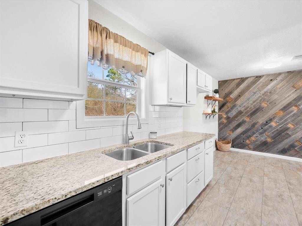 Kitchen with View of the back of property through the window