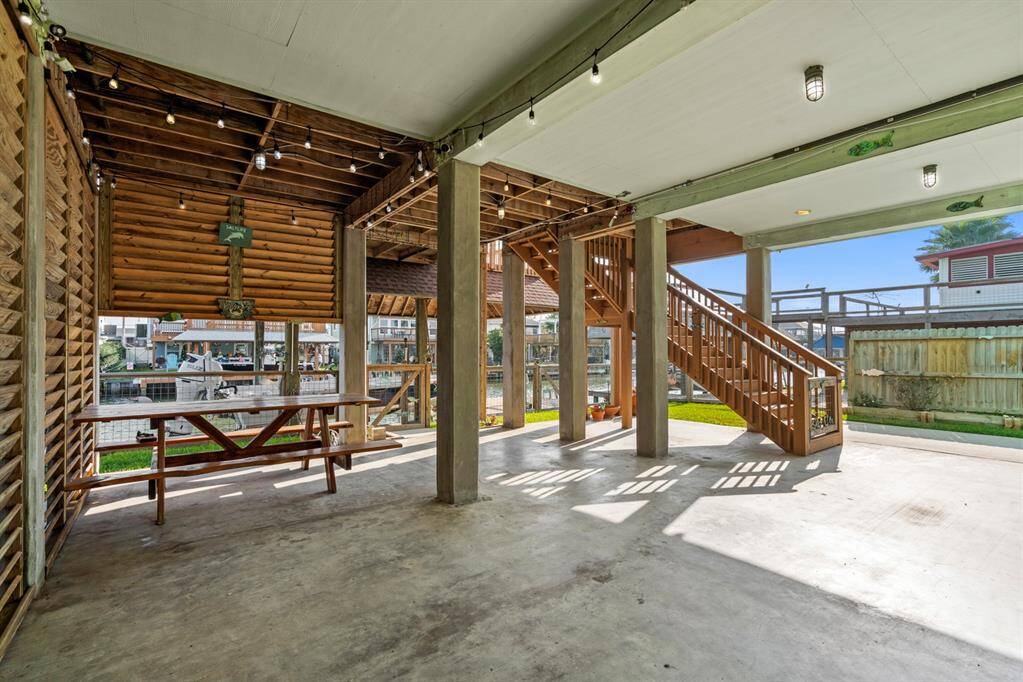 Under the home you will find a shady entertaining area. Picnic table conveys with purchase.