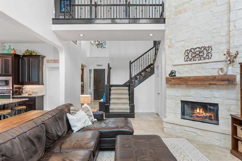 Floor to ceiling stone gas log fireplace. 1840's Hemlock Timber Mantel