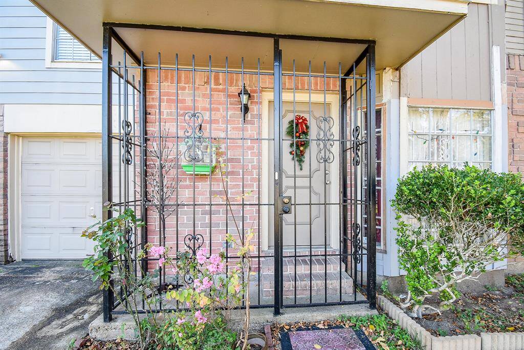 Here's a closer look at the gated front entrance providing extra privacy and security. inside, are 3 bedrooms (all upstairs) and 2-1/2 baths, occupying 1,739 square-feet of interior living space.