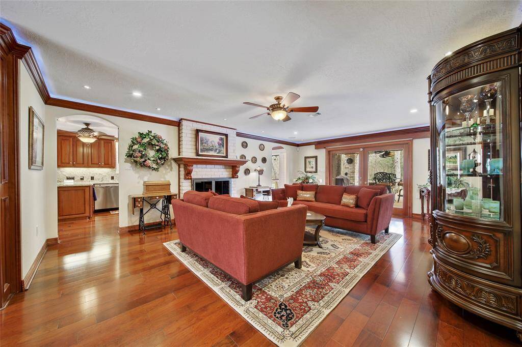 Family room view as you enter the home. Cherry hardwood flooring throughout main downstairs areas.