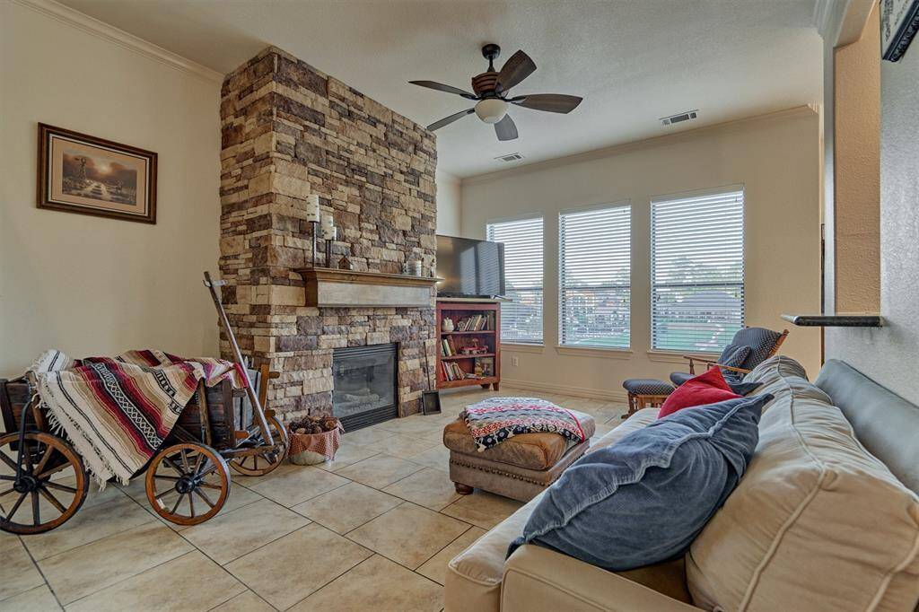 The sitting area is open from the kitchen and overlooks the back yard and lake.