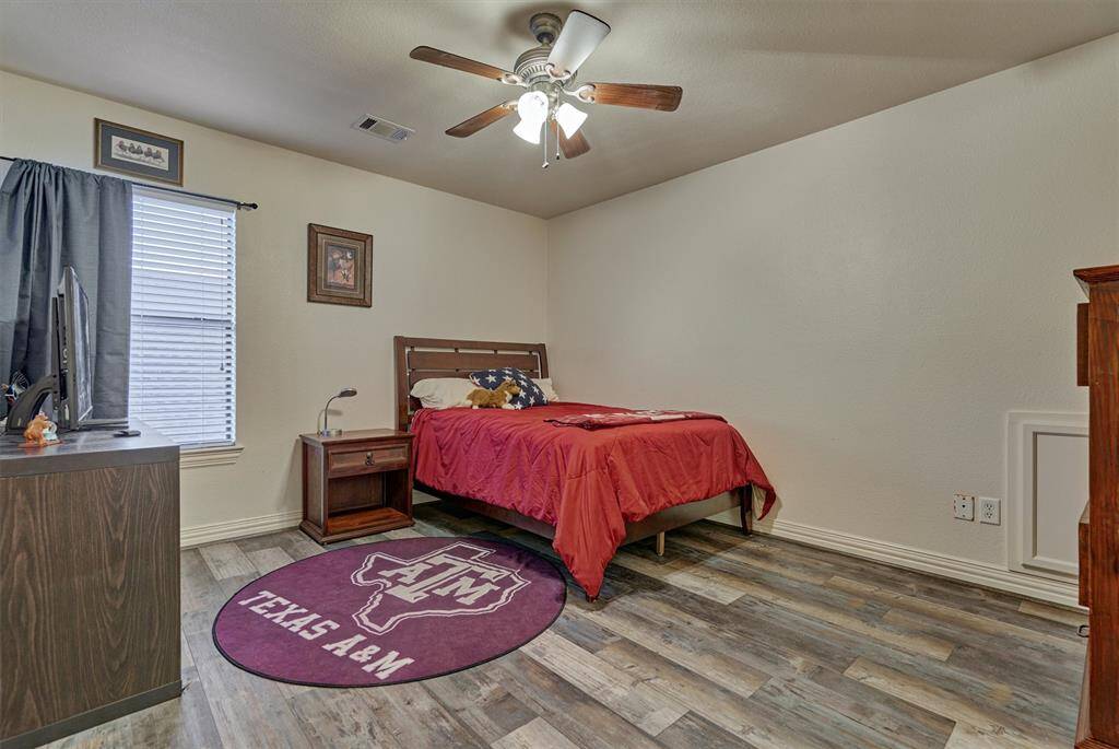 The third bedroom is generously sized and includes a spacious walk-in closet, providing plenty of room for storage and comfort.