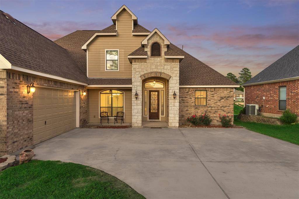 Charming covered front porch adds to the home’s curb appeal, while the convenient side-entry garage enhances both functionality and aesthetics.