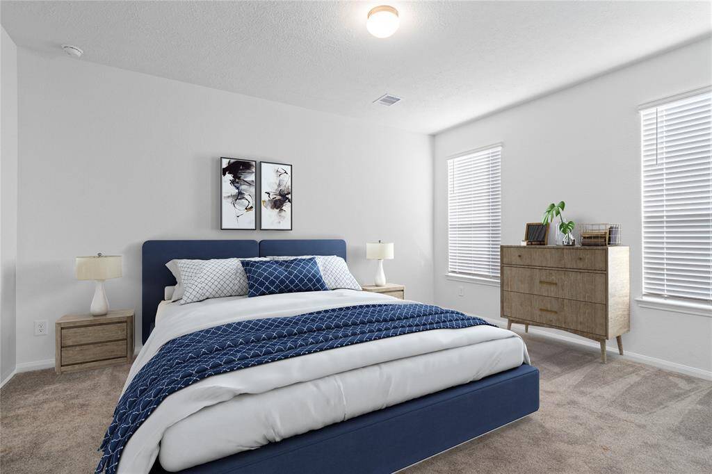 Come and unwind after a long day in this magnificent primary suite! This spacious room features plush carpet, warm paint, high ceilings and large windows with privacy blinds.