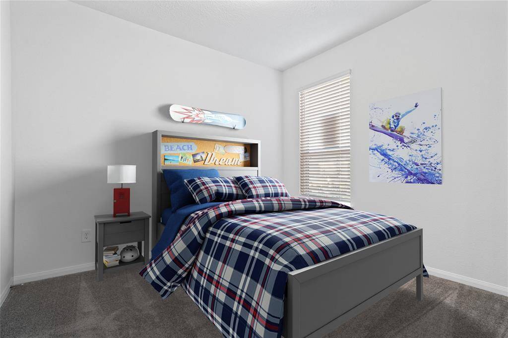 Secondary bedroom features plush carpet, custom paint, large window with privacy blinds and ample closet space.