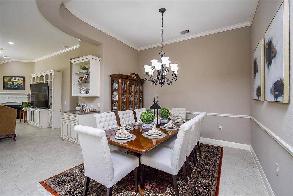 Formal dining room can easily fit a table for eight.