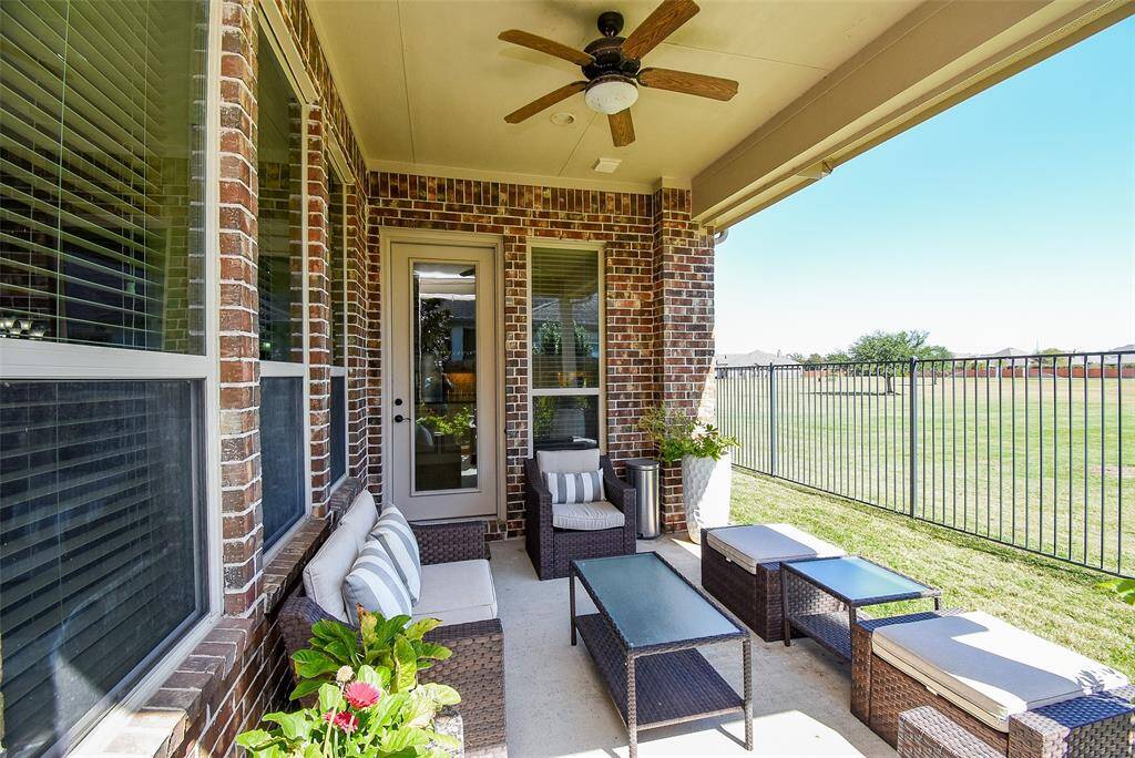 Private patio overlooks the manicured park with convenient, direct access to the kitchen.