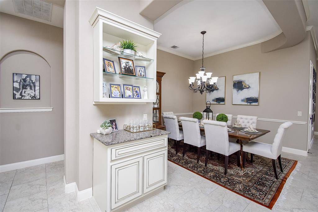 Dining room dry bar can easily function as a display space; food service bar; or a coffee/tea bar as well.