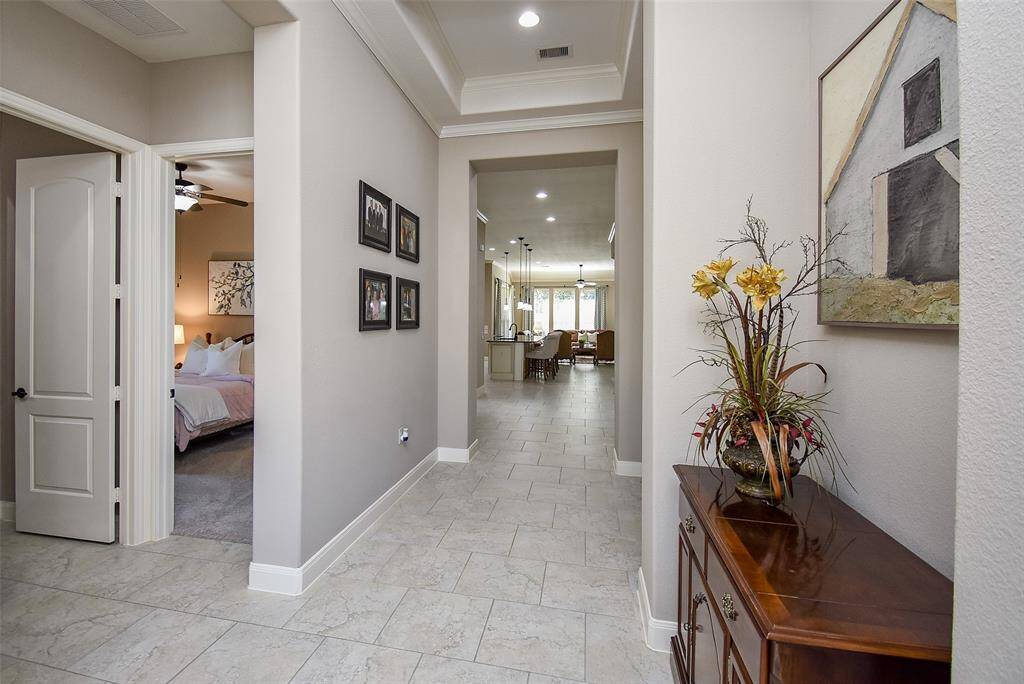Split Floor Plan with the secondary bedrooms at the front of the home off the long, wide entry foyer.
