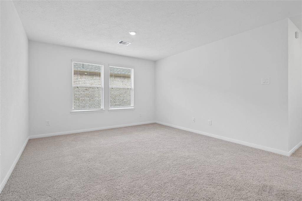 Come upstairs and enjoy a day of leisure in this fabulous loft! This space features plush carpet, high ceiling, recessed lighting, custom paint and large windows with privacy blinds.