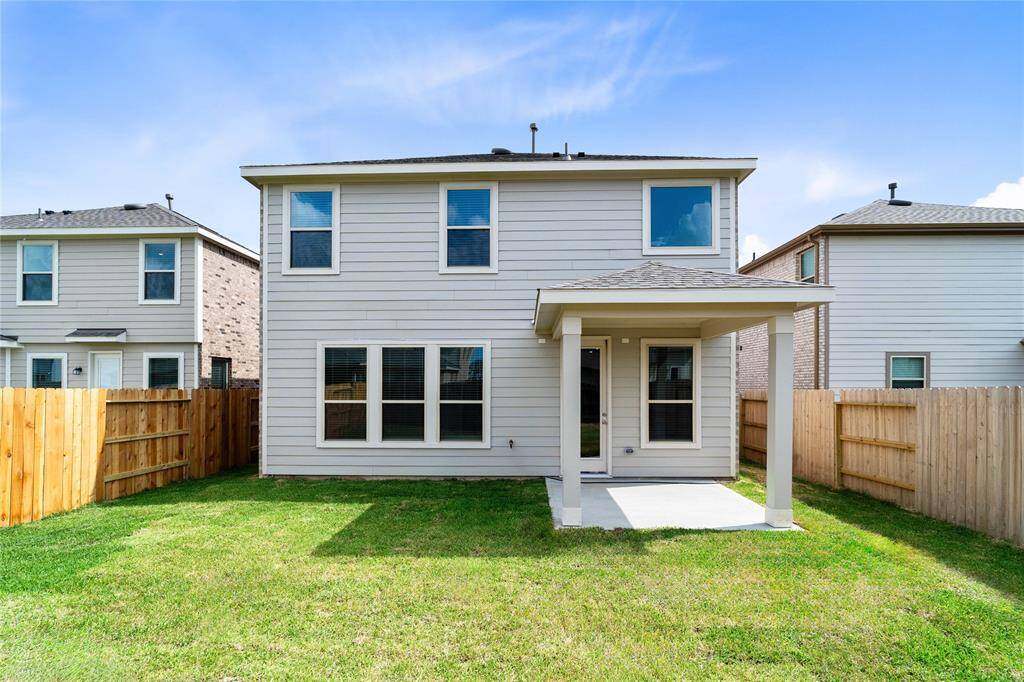 Come and see this spacious backyard with its beautiful covered patio. There is plenty of room for the kids to play and adults to relax!