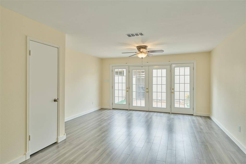 Newly installed patio doors enhance natural light and outdoor access.