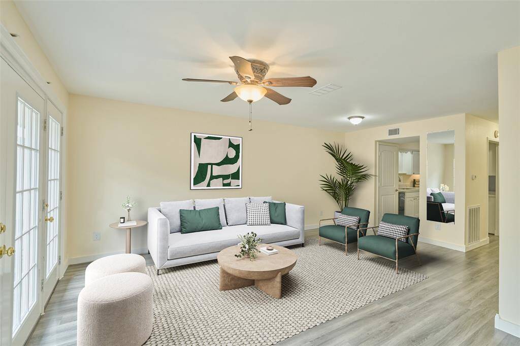 Welcome to 2308 Winrock—an inviting, spacious family room featuring sleek .flooring, abundant natural light, and a neutral palette for easy customization. Perfect for creating your dream sanctuary. Full set of new patio doors added 2023.This photo is virtually staged.