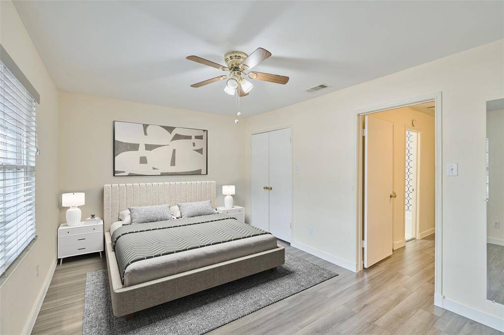 Spacious primary bedroom on the second floor with an ensuite bath.This photo is virtually staged.