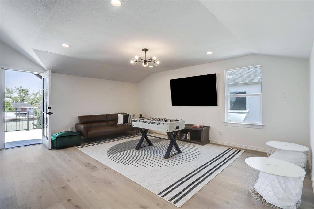 Entire suite on upper level which may be occupied by one tenant or shared as a game room/ common space amongst all tenants. Door leads to a spacious rooftop terrace
