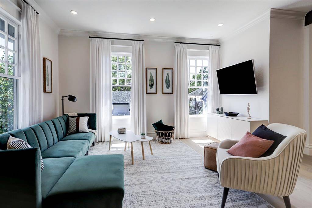 Living room just off the kitchen is spacious with ample natural light filling the room