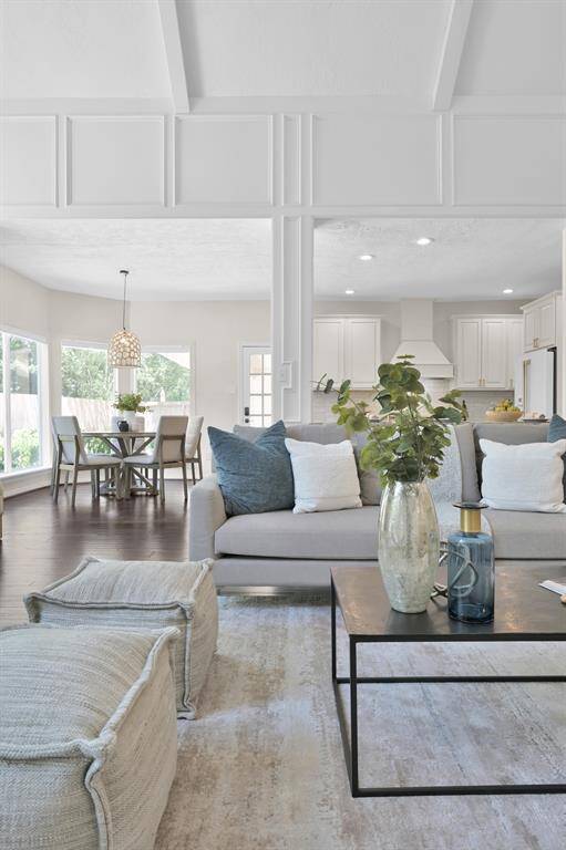 Layered with natural light and elegant textures, this open-concept space flows seamlessly into the breakfast area—perfect for both intimate mornings and lively gatherings.