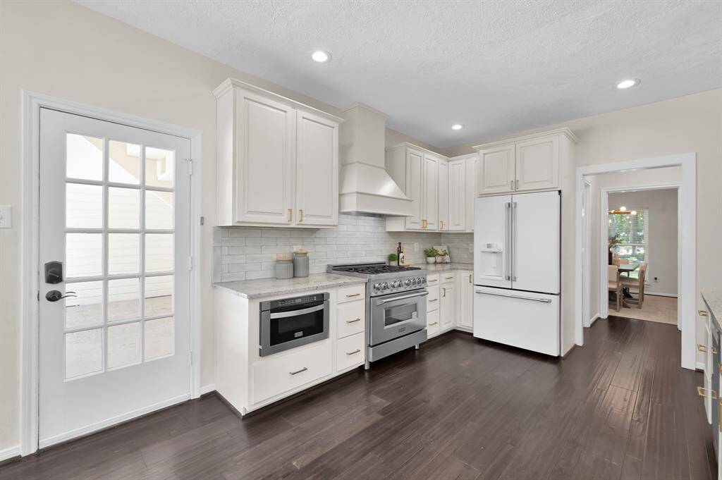 Outfitted with premium appliances, custom millwork, and sleek quartz surfaces—this chef-worthy kitchen combines luxury finishes with everyday functionality.