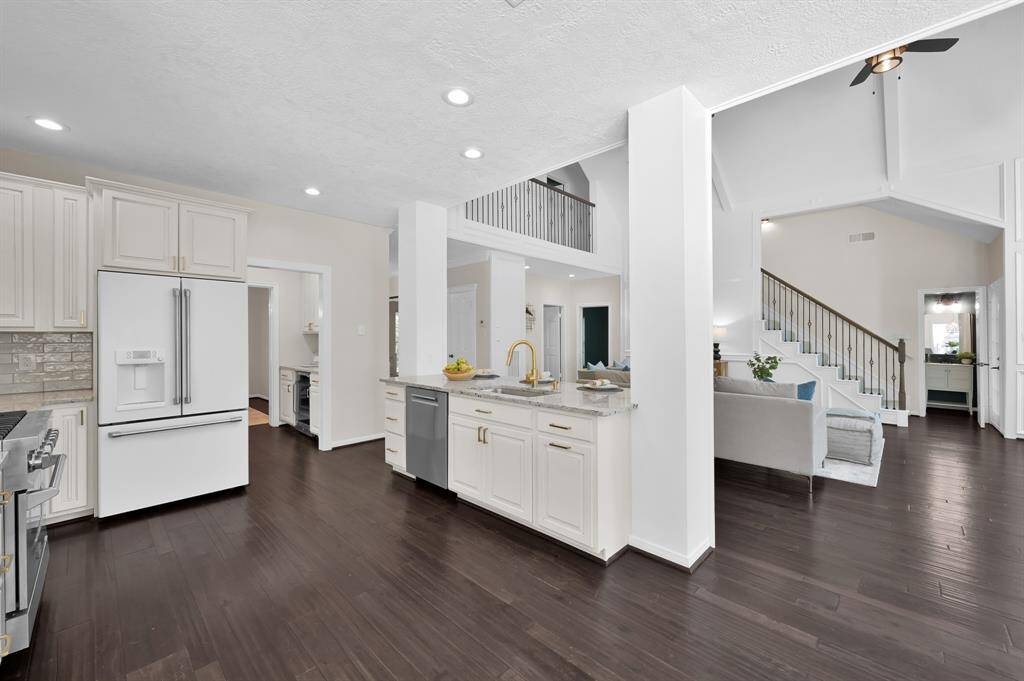 This open-concept kitchen is perfectly positioned at the heart of the home—blending effortlessly into the living space for seamless connection and elevated entertaining.