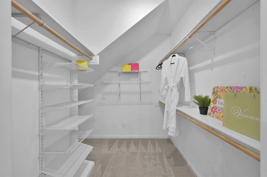 The spacious walk-in closet offers custom built-ins, ample shelving, and thoughtful organization—providing a boutique-style dressing experience right at home.