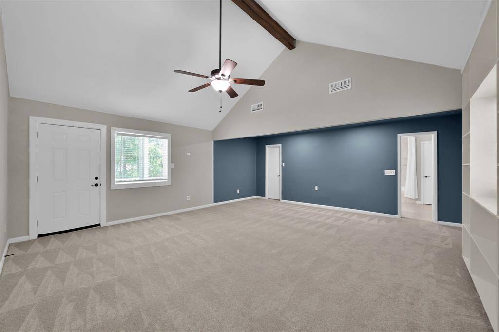 Private and spacious, this separate guest quarters offers its own entrance, vaulted ceilings, and private balcony—ideal as a second primary suite, multigenerational living, or a luxe guest retreat.