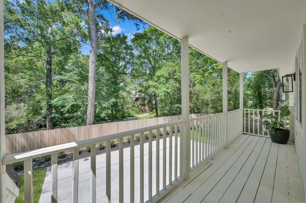 Tucked beneath the trees, this private upper balcony offers a peaceful perch to enjoy morning coffee, evening breezes, or quiet moments surrounded by nature.