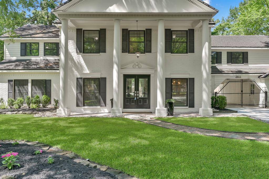 Graceful symmetry and grand columns set the tone for this stately façade—an architectural statement in The Woodlands' most coveted enclave.