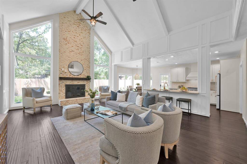 An open-concept masterpiece where the dramatic stone fireplace, soaring beams, and chef’s kitchen converge—creating a seamless flow for luxurious living and entertaining.
