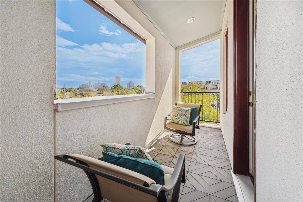 A lovely balcony off of the game room provides stunning downtown views.