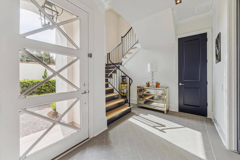 The elegant entryway welcomes guests to this beautiful home.