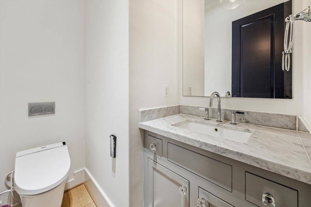 Full first floor bath with beautiful countertops and walk-in shower.
