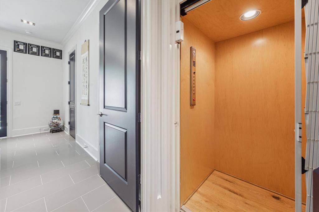 Do not want to take the stairs, no worries!  This beautiful elevator services each of the five floors.  Located immediately upon entering from the garage, groceries or luggage can be loaded with ease and deliver you to any floor.