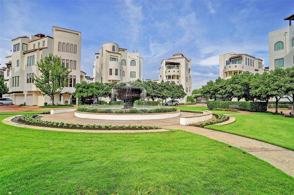Spanish inspired, luxury townhome and villa community with beautiful green space.