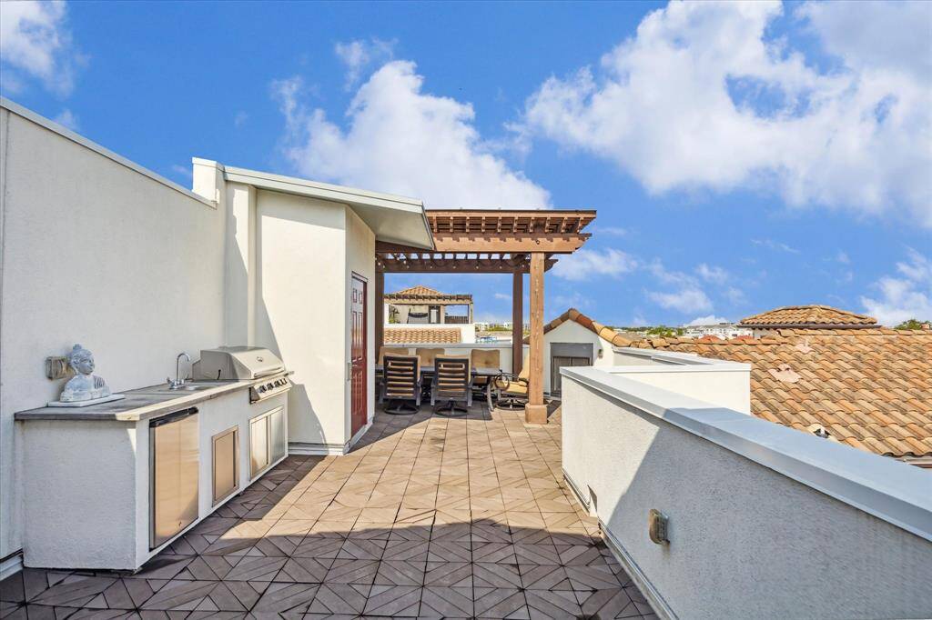 The expansive fifth floor terrace is truly another living area.   With a wood burning fireplace, seating area, space for a tv and a summer kitchen, you will never want to leave.