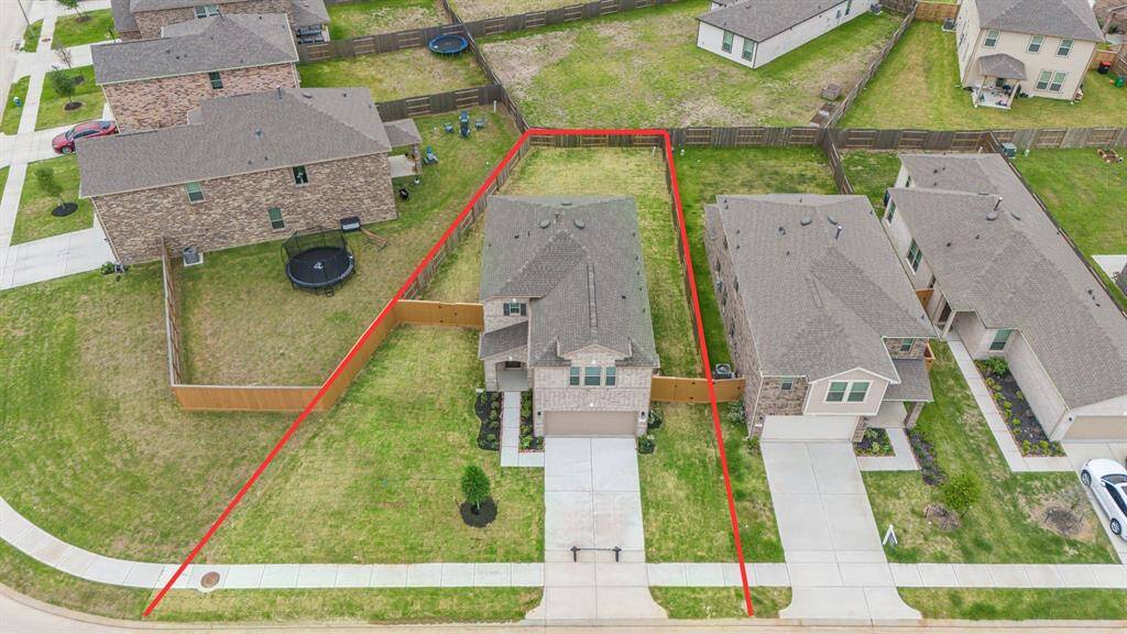 Amazing aerial shot of this gorgeous KB Home home situated on a LARGE LOT with lush landscaping, and well manicured lawns.