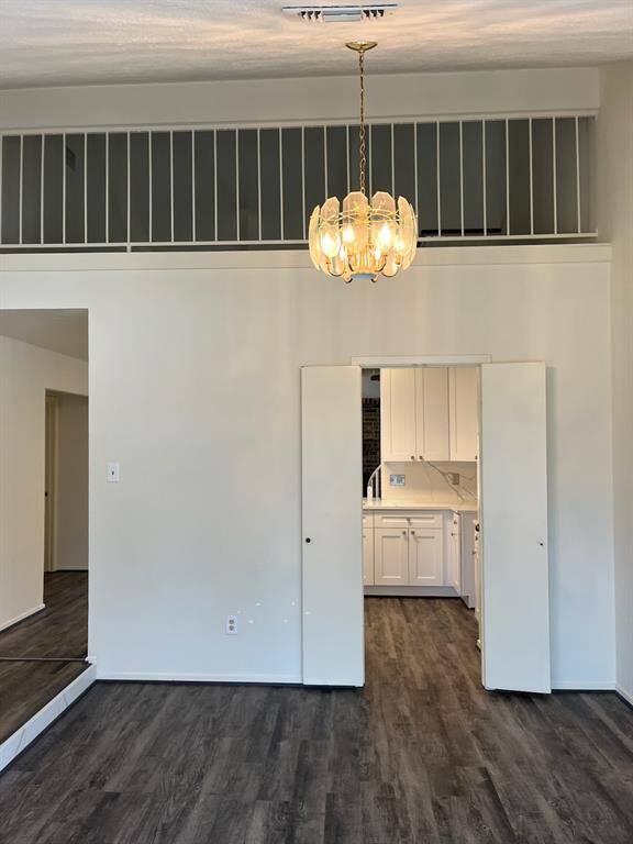 Primary bedroom has lots of windows allowing lot of light into home