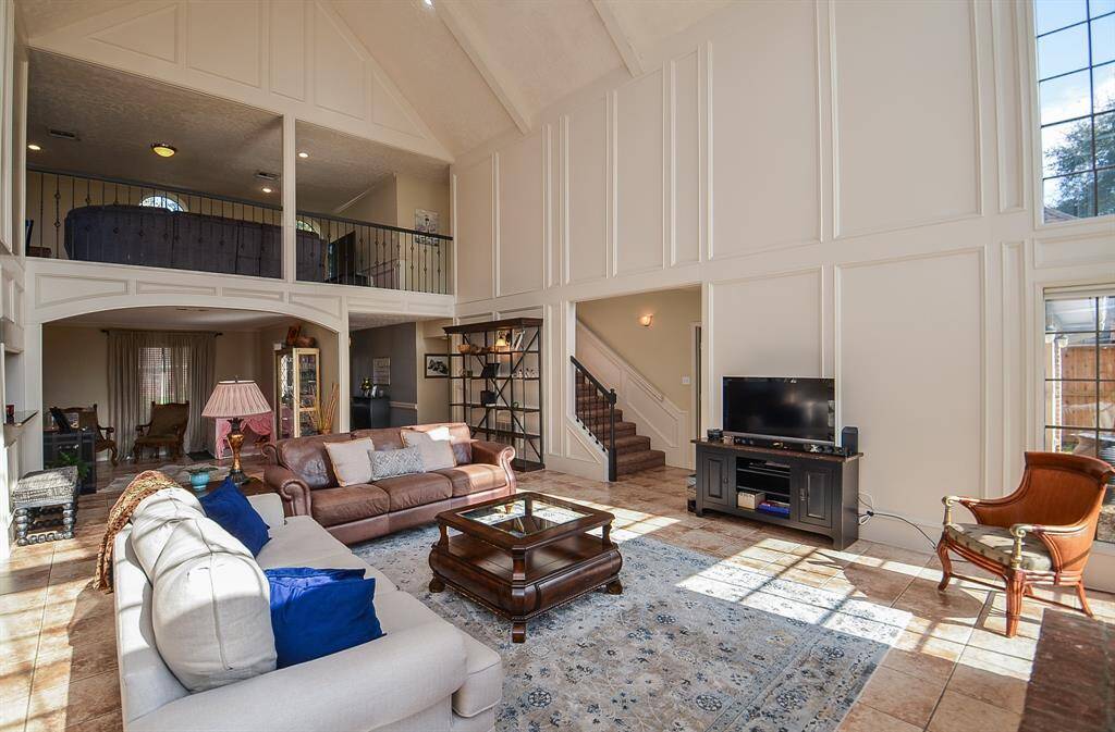 The game room is upstairs and overlooks the den.