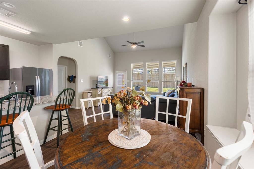 The kitchen/dining area is open to the two-story spacious family room!