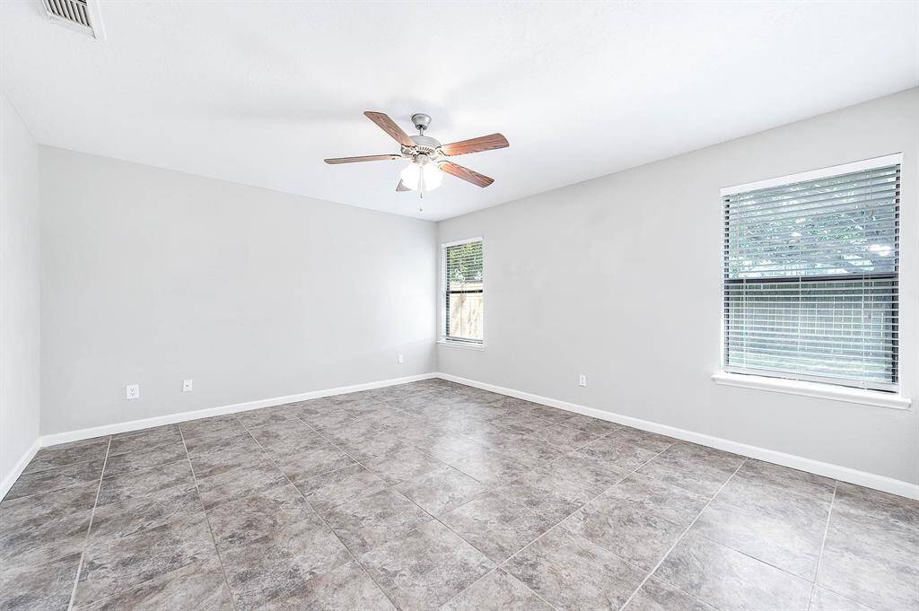 Spacious primart bedroom off the back of the home.