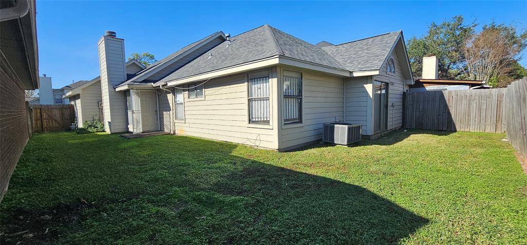 Cozy backyard with lots of room for gardening or an extended covered patio.