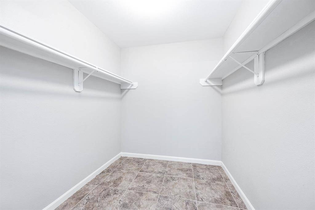 Great size walk in primary closet