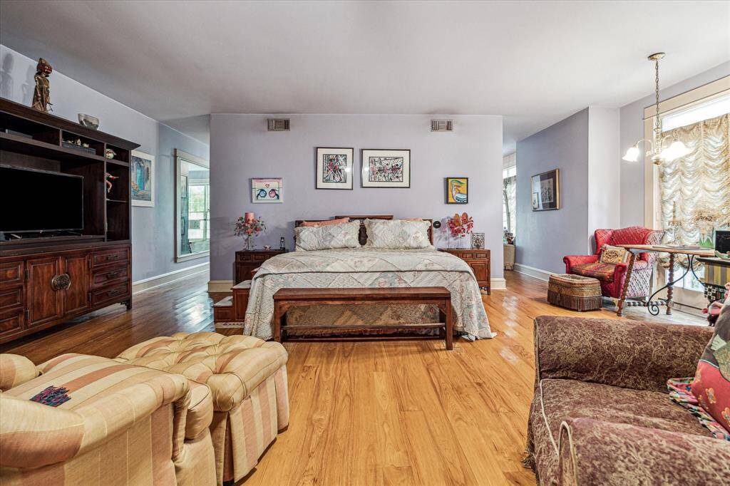 Spacious primary suite with large walk-in closets and dual bathrooms.