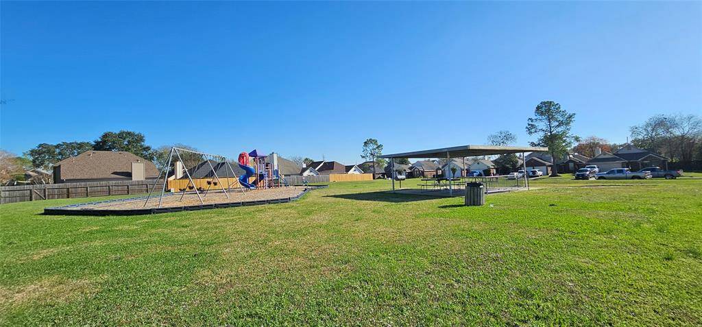 The neighborhood playground is an open grassy area, and a covered pavilion.